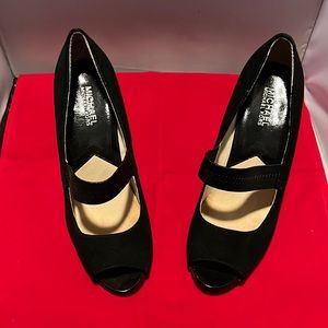 Michael Kors black suede peep toe pumps, Strap is elasticized with a unique heel